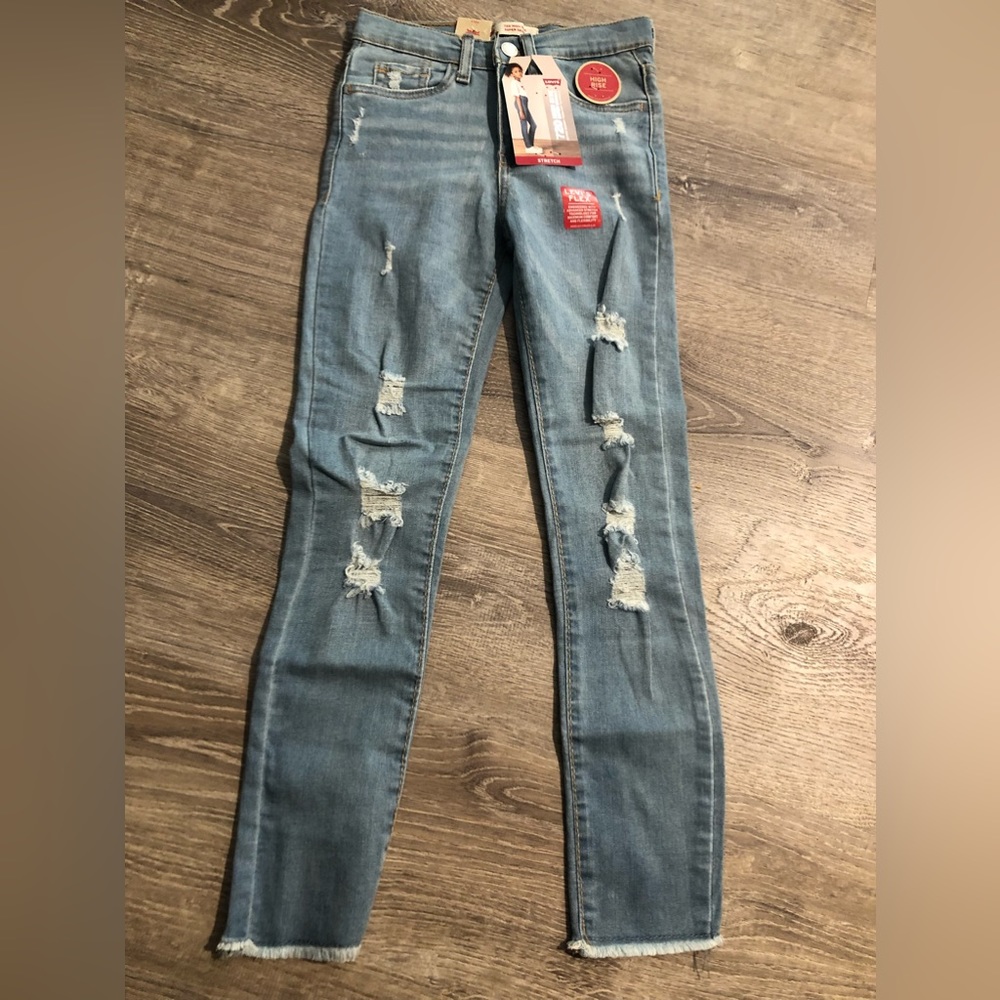 Levi’s jeans. Distressed. Frayed hem